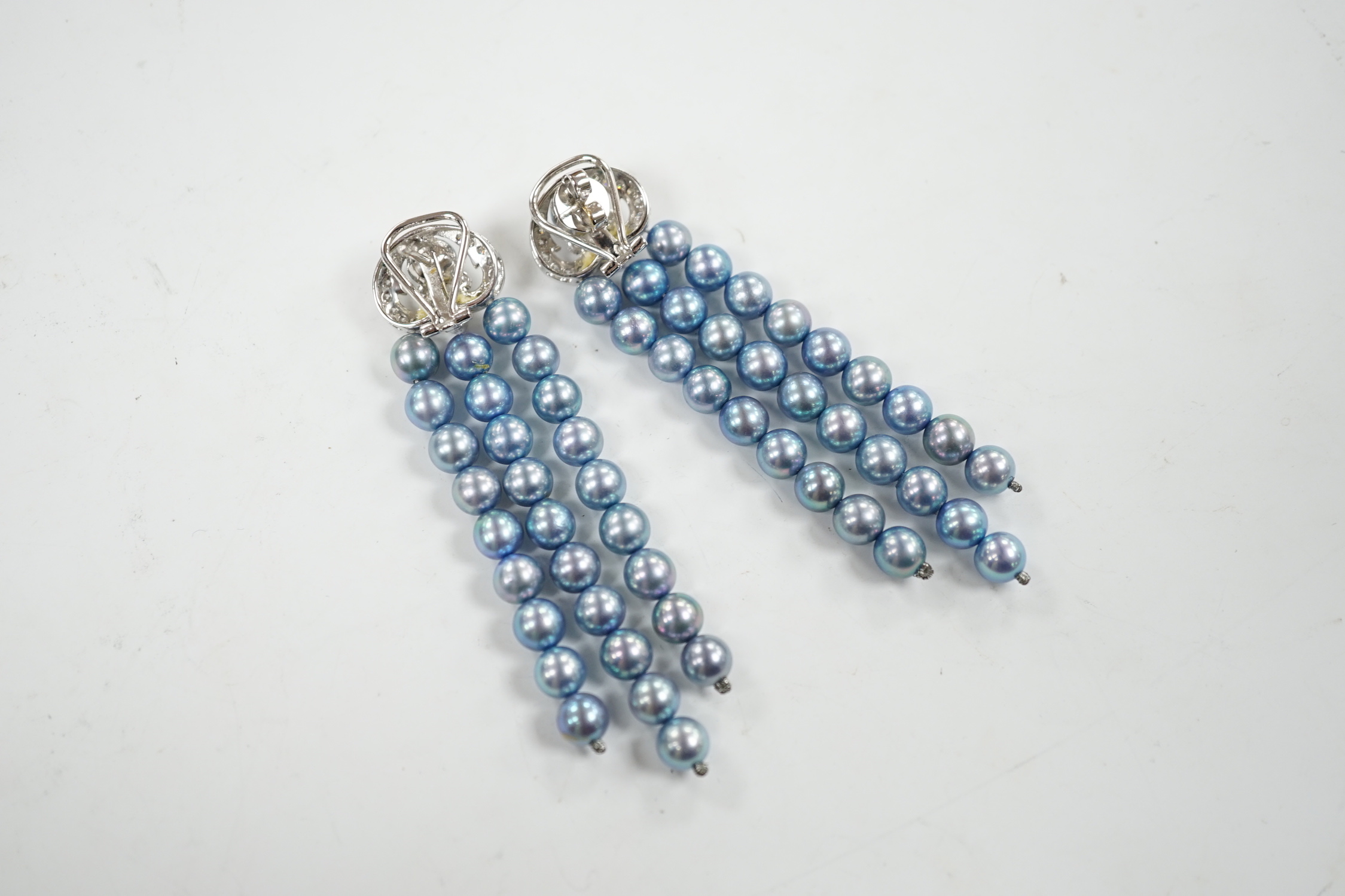 A modern pair of white metal, diamond chip cluster and bluey/grey three row cultured pearl tassel drop earrings, 89mm.